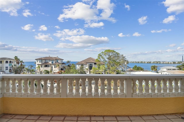 balcony featuring a water view