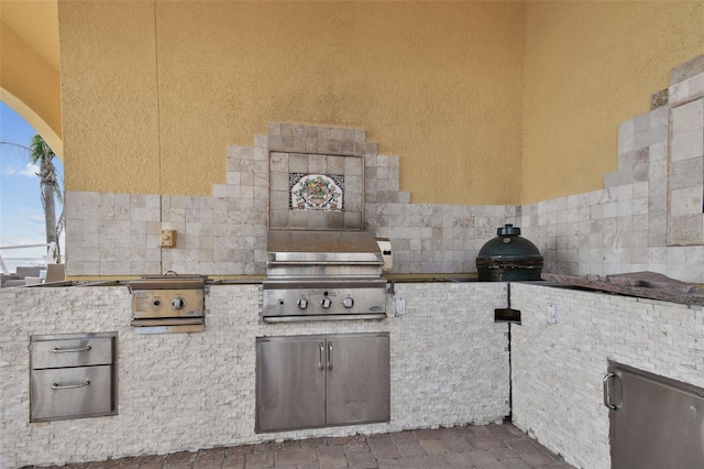 view of patio with a grill and an outdoor kitchen