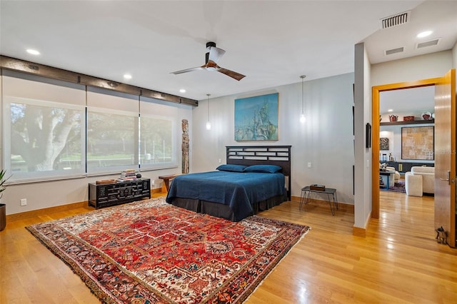 bedroom featuring ceiling fan and wood-type flooring