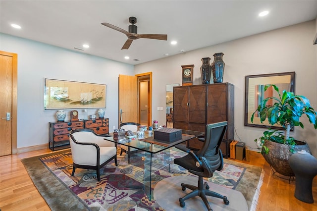 office area with ceiling fan and wood-type flooring