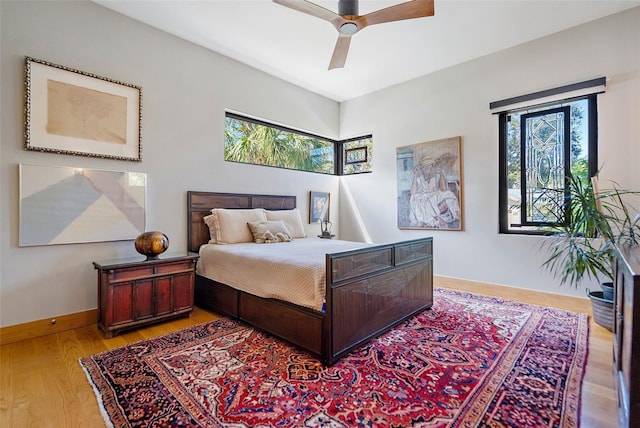 bedroom featuring ceiling fan and light hardwood / wood-style flooring