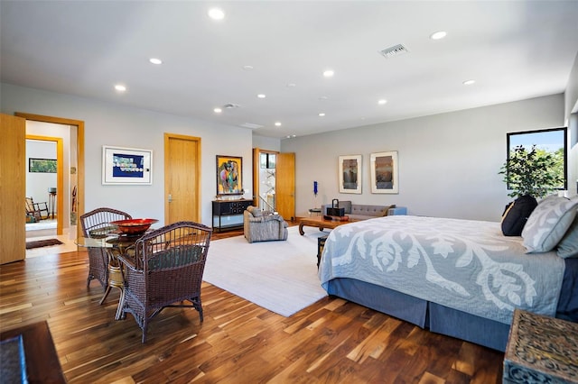 bedroom with hardwood / wood-style floors