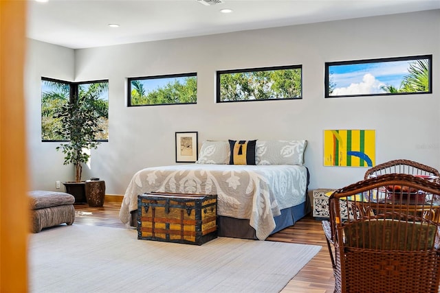 bedroom with wood-type flooring