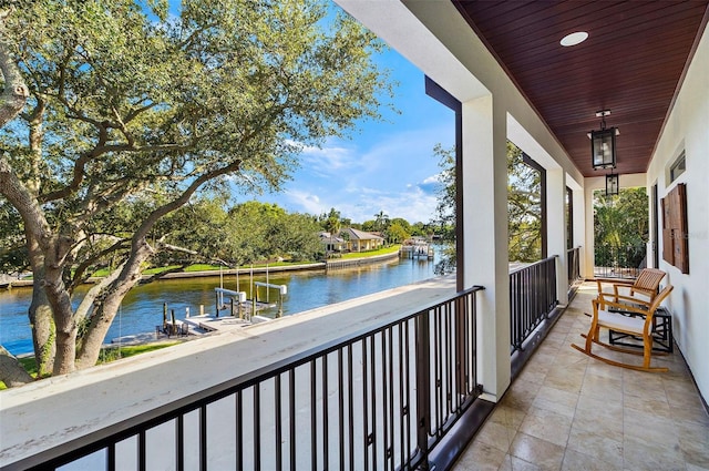 balcony featuring a water view