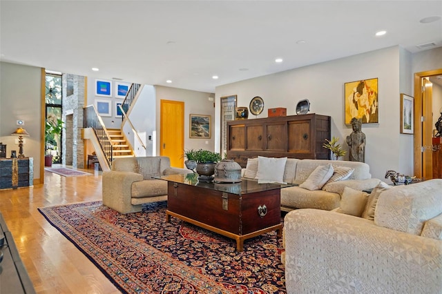 living room with hardwood / wood-style floors and expansive windows