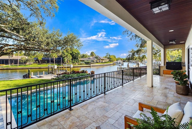 view of patio with a water view