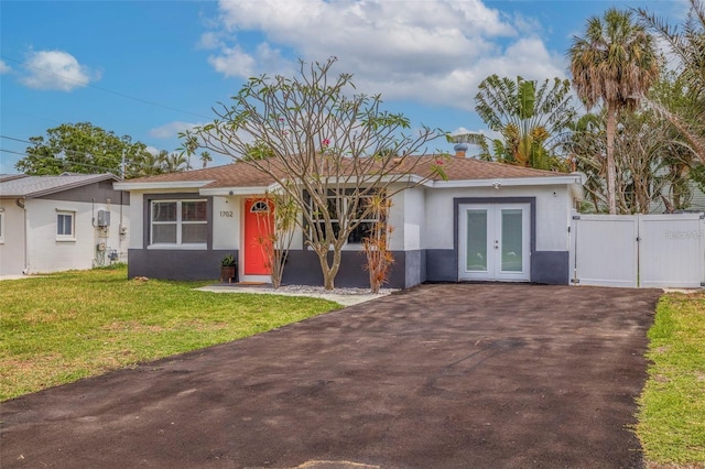 view of front of home featuring french doors and a front yard