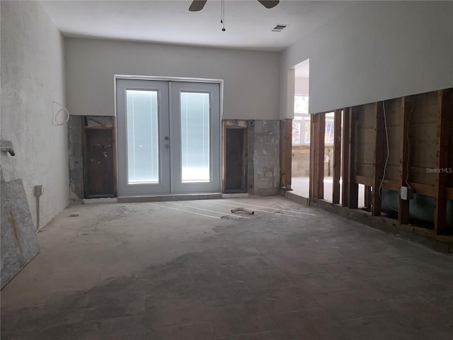 interior space with french doors and ceiling fan