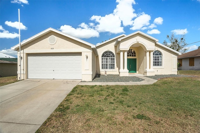 ranch-style house featuring a garage and a front lawn