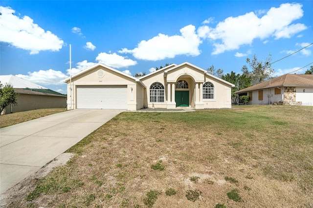 ranch-style house with a garage and a front lawn