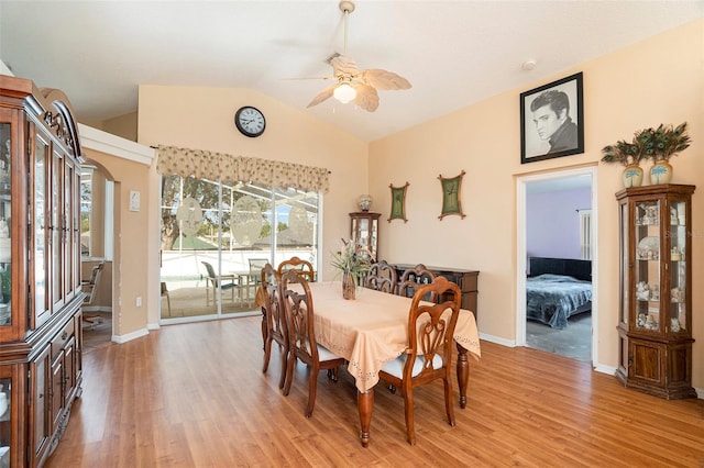 dining space with light hardwood / wood-style flooring, lofted ceiling, and ceiling fan