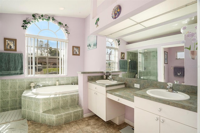 bathroom featuring vanity, tile patterned floors, a wealth of natural light, and shower with separate bathtub