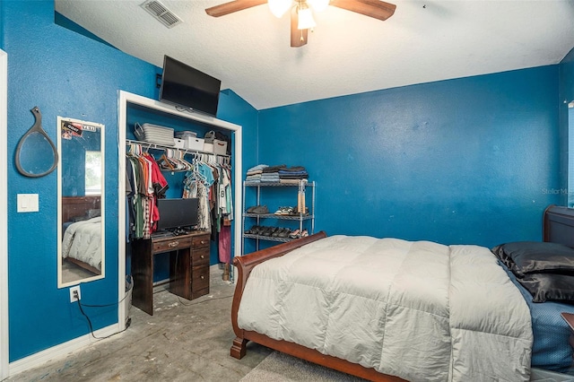 bedroom featuring a closet, ceiling fan, and lofted ceiling