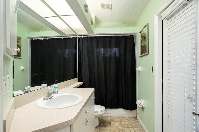 full bathroom with lofted ceiling, toilet, tile patterned flooring, vanity, and a textured ceiling