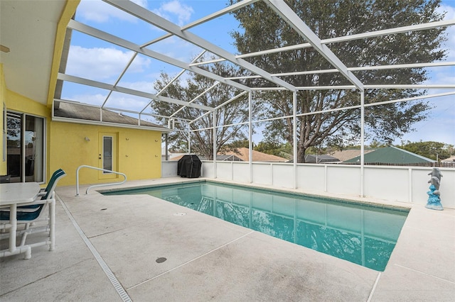 view of pool featuring a grill, a lanai, and a patio area