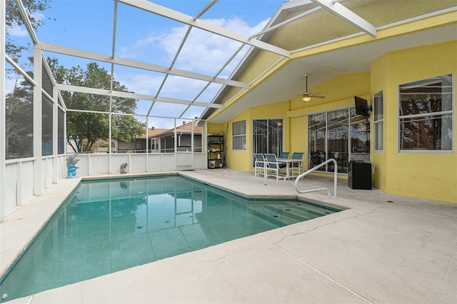 view of swimming pool featuring a patio, a lanai, and ceiling fan