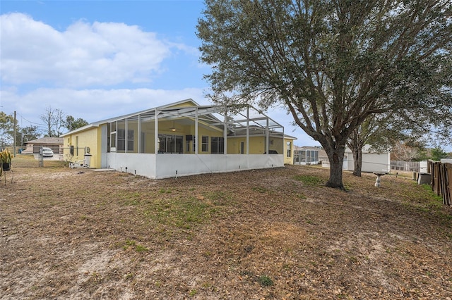 view of side of home featuring a lanai