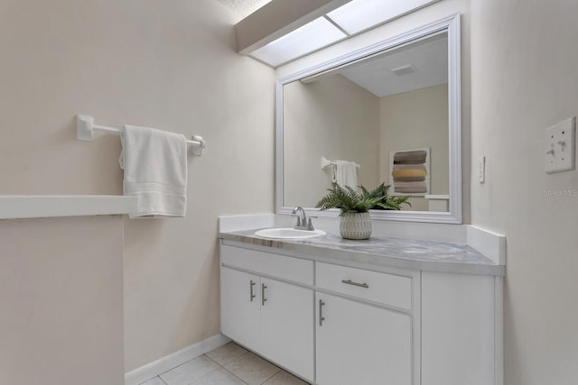 bathroom with vanity and tile patterned floors