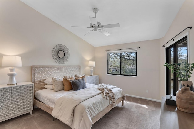 bedroom featuring ceiling fan, multiple windows, vaulted ceiling, and hardwood / wood-style floors