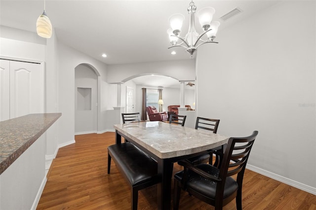 dining area with hardwood / wood-style floors