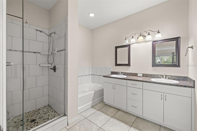 bathroom with vanity, shower with separate bathtub, and tile patterned flooring