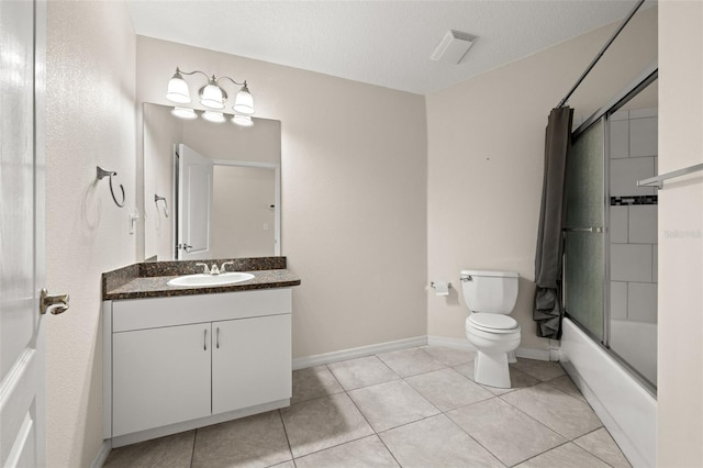 full bathroom featuring enclosed tub / shower combo, a textured ceiling, vanity, tile patterned floors, and toilet