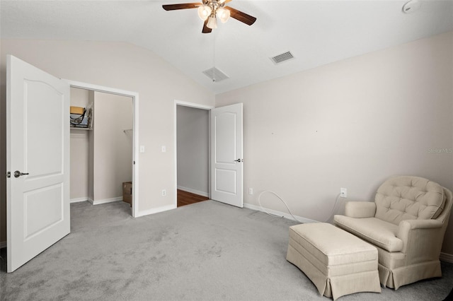 unfurnished room featuring ceiling fan, lofted ceiling, and carpet