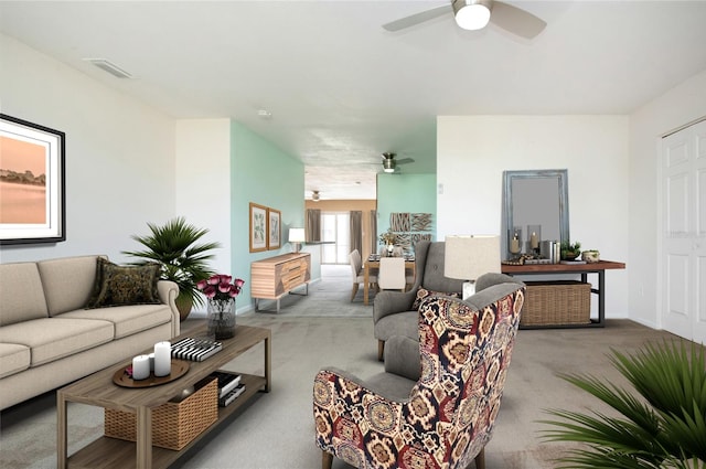 living room with carpet floors and ceiling fan