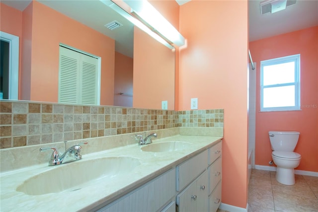 bathroom featuring vanity, decorative backsplash, toilet, and tile patterned flooring