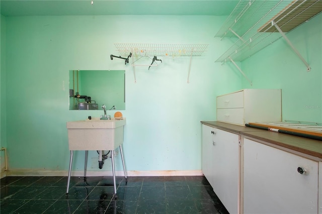 spacious closet featuring sink