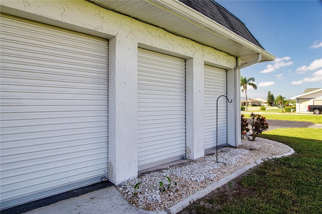 garage with a lawn