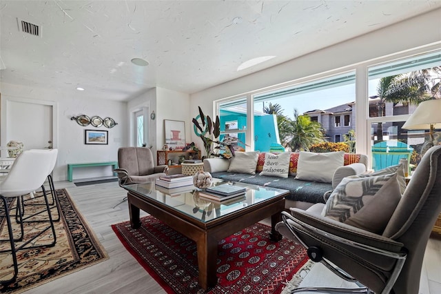 living room with light hardwood / wood-style flooring