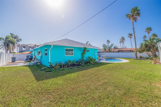 view of yard with a fenced in pool and a patio