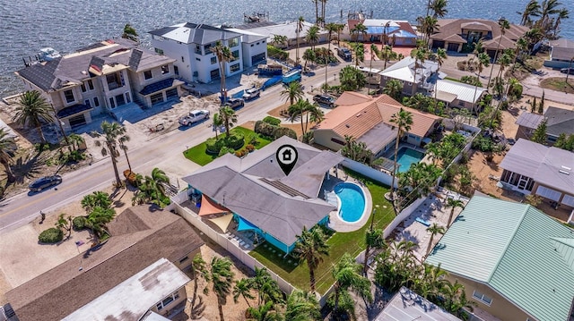 birds eye view of property with a water view