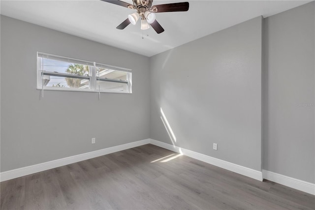 spare room featuring ceiling fan and hardwood / wood-style floors