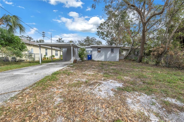 exterior space featuring a carport