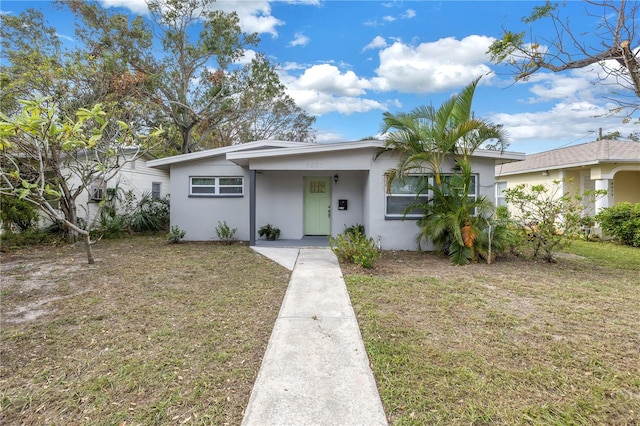 ranch-style home with a front yard