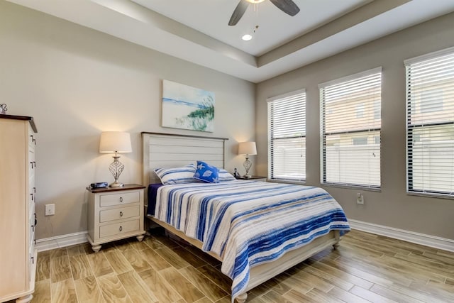 bedroom featuring light hardwood / wood-style floors and ceiling fan