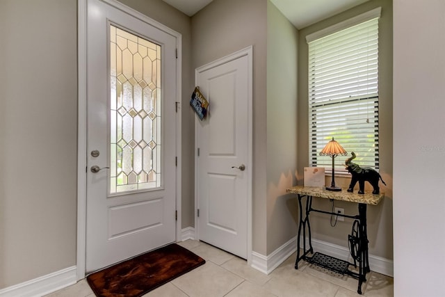 entryway with plenty of natural light and light tile patterned floors