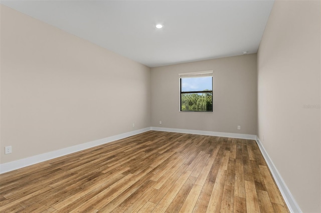 unfurnished room with light hardwood / wood-style flooring