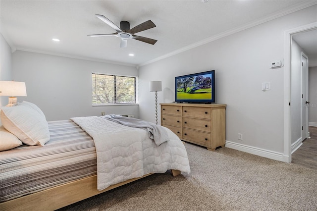 carpeted bedroom featuring crown molding and ceiling fan