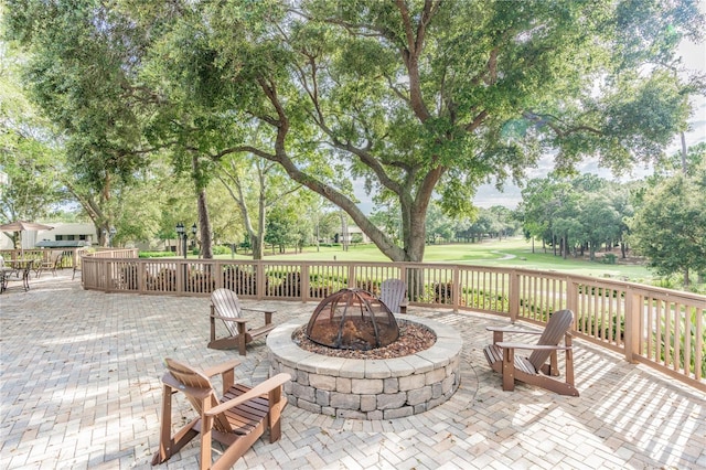 view of patio featuring an outdoor fire pit