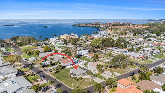 birds eye view of property with a water view