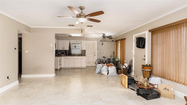 living room with ceiling fan, sink, and crown molding