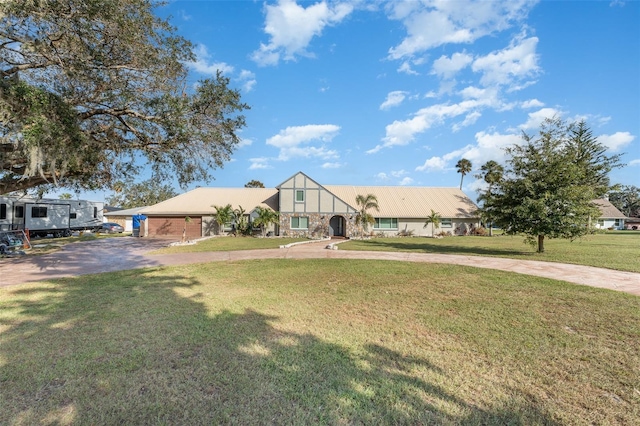 view of front of house with a front lawn and a carport