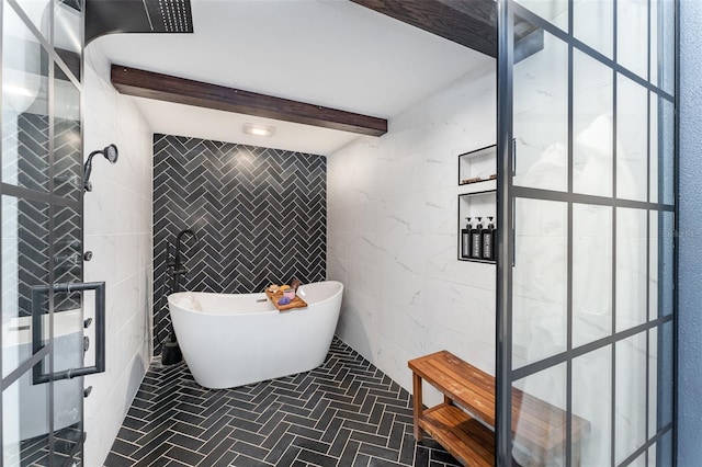 bathroom featuring beam ceiling, tile walls, and a bathing tub