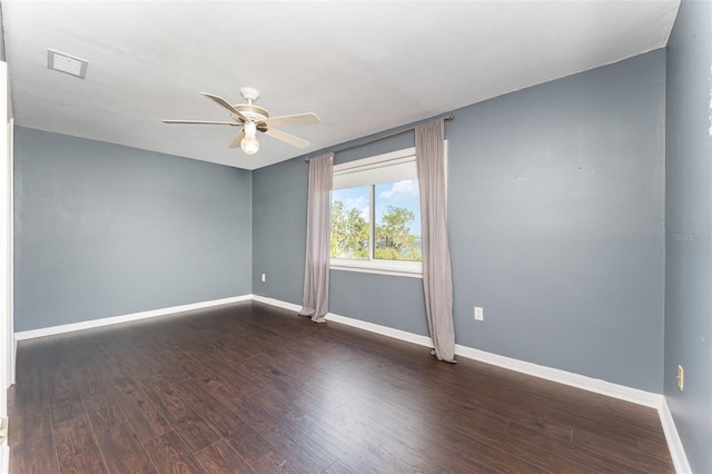 unfurnished room with ceiling fan and dark hardwood / wood-style flooring