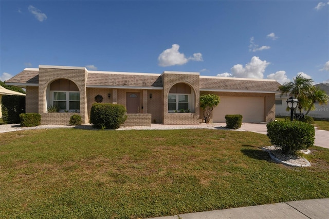 ranch-style house with a front lawn and a garage