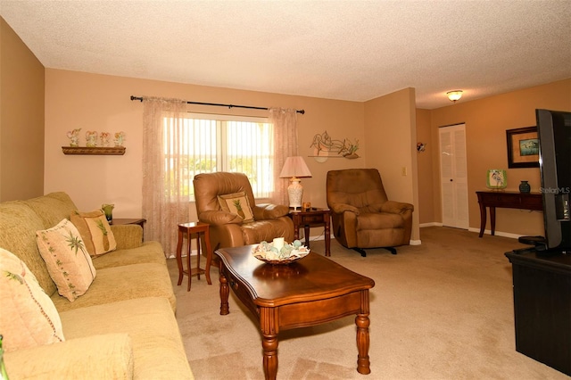 living room featuring light carpet and a textured ceiling