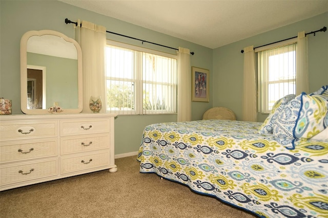 bedroom featuring light colored carpet